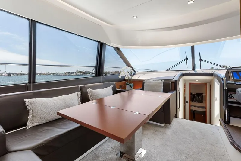 Slide: The Image of Luxurious interior of 2016 Prestige 550 yacht with panoramic windows and elegant seating area. - 18