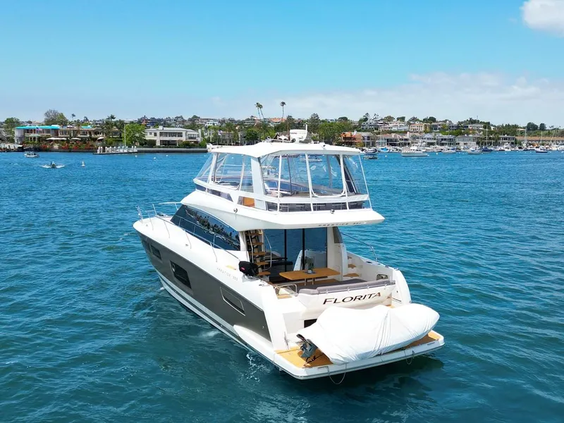 Slide: The Image of Luxury 2016 Prestige 550 yacht cruising in scenic coastal waters. - 2