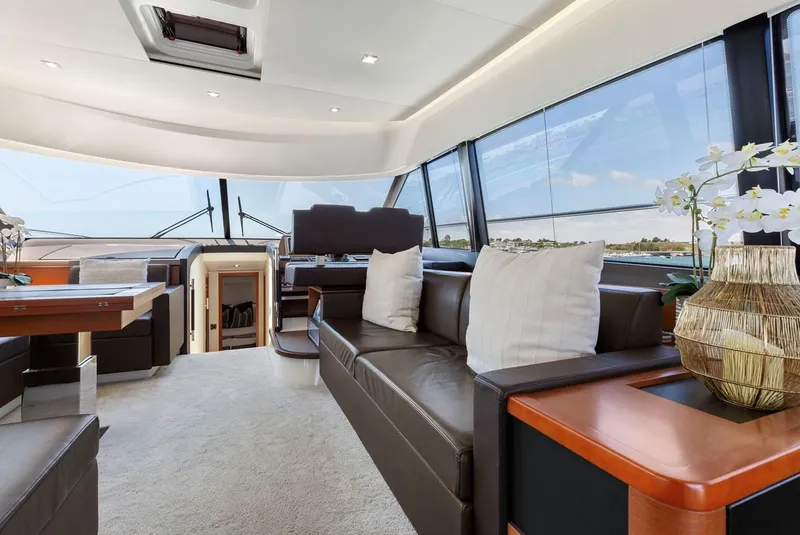 Slide: The Image of Luxurious interior of 2016 Prestige 550 yacht with elegant seating and panoramic windows. - 20