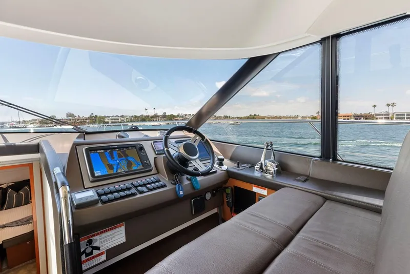 Slide: The Image of Interior view of 2016 Prestige 550 yacht cockpit with navigation system. - 22