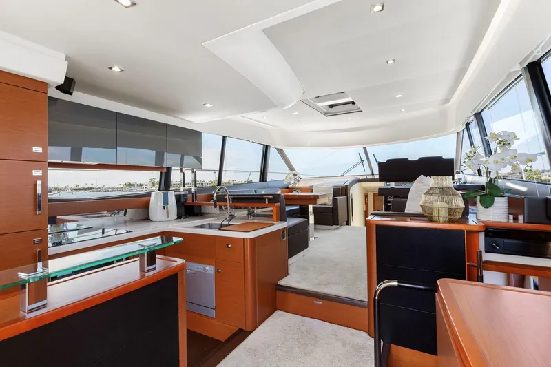 Slide: The Image of Luxurious interior of 2016 Prestige 550 yacht with modern kitchen and seating area. - 24
