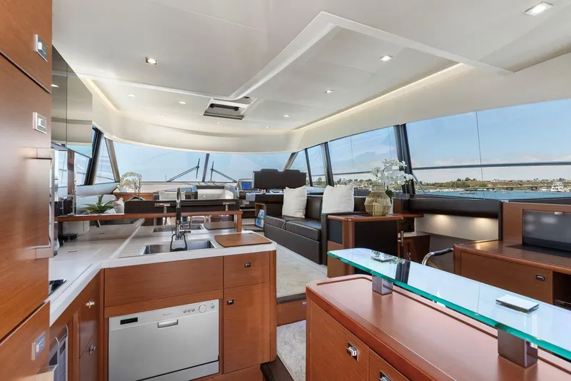 Slide: The Image of Luxurious interior of 2016 Prestige 550 yacht with modern kitchen and seating area. - 25