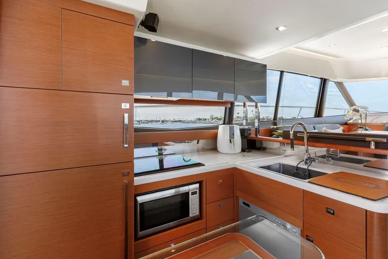 Slide: The Image of Modern kitchen interior on 2016 Prestige 550 yacht with sleek cabinetry and appliances. - 26