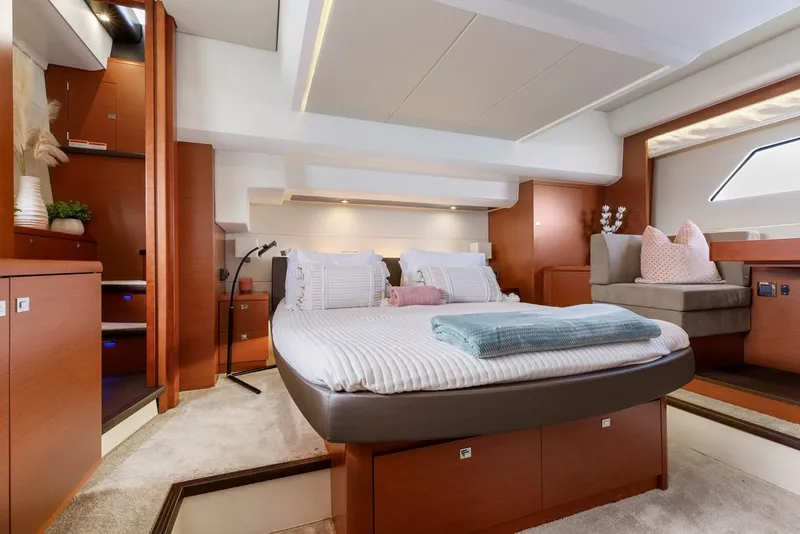 Slide: The Image of Luxurious interior of a 2016 Prestige 550 yacht with modern bedroom design. - 29