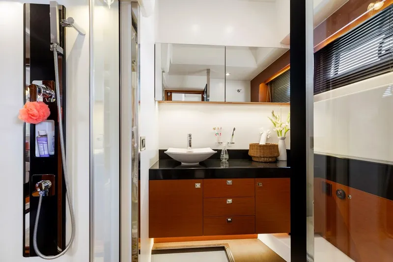 Slide: The Image of Luxurious bathroom in 2016 Prestige 550 yacht with modern fixtures and elegant design. - 33
