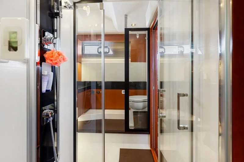 Slide: The Image of Luxurious bathroom interior of 2016 Prestige 550 yacht with modern fixtures and glass shower. - 34