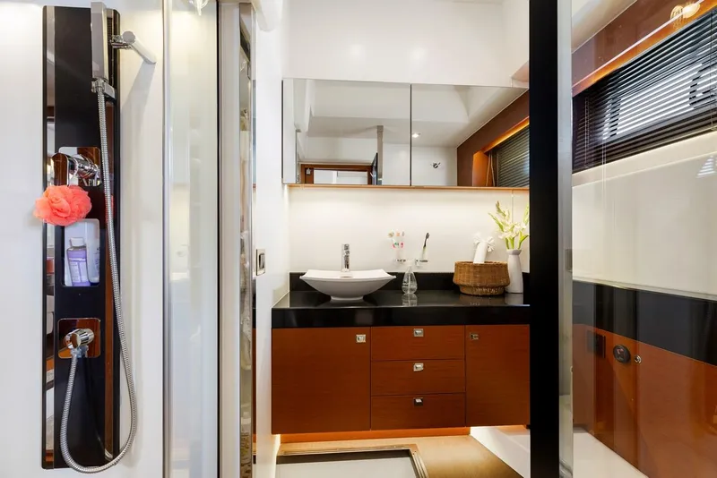 Slide: The Image of Luxurious bathroom in 2016 Prestige 550 yacht with modern fixtures and elegant design. - 35