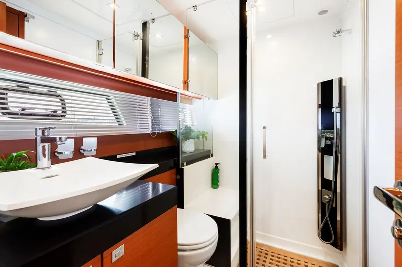 Slide: The Image of Luxurious bathroom in 2016 Prestige 550 yacht with modern fixtures and sleek design. - 37