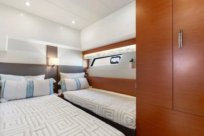 Slide: The Image of Luxurious cabin interior of 2016 Prestige 550 yacht with twin beds and modern decor. - 38