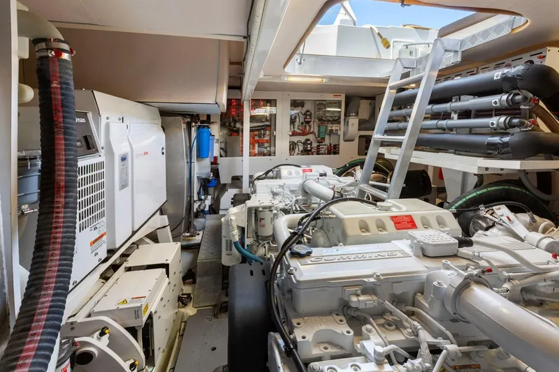 Slide: The Image of Engine room of a 2016 Prestige 550 yacht, showcasing machinery and equipment. - 39