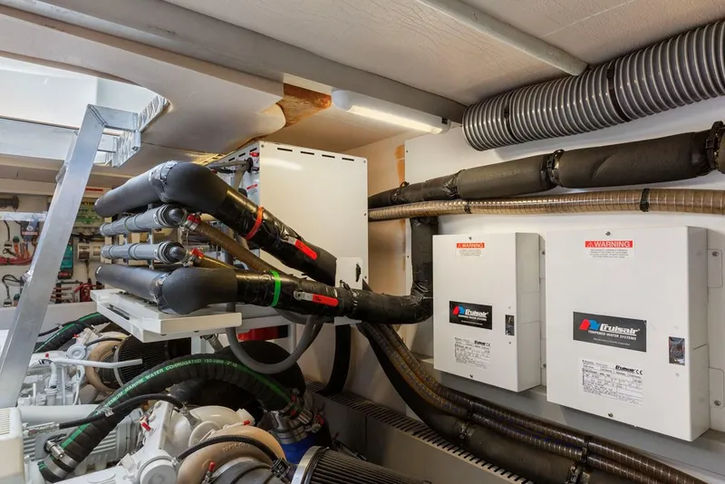 Slide: The Image of Engine room of 2016 Prestige 550 yacht with complex wiring and equipment. - 40