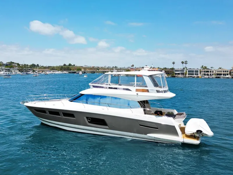 Slide: The Image of Luxury 2016 Prestige 550 yacht cruising on a sunny day. - 48