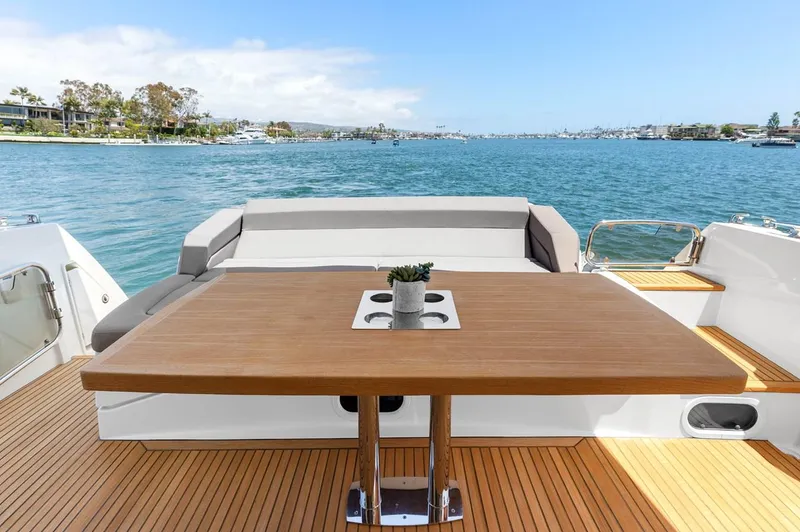 Slide: The Image of Prestige 550 yacht deck with table, ocean view, 2016 model. - 8