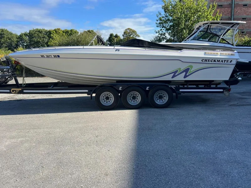 The Image of 1994 Checkmate 253 Convincor boat on trailer, parked outdoors. - 0