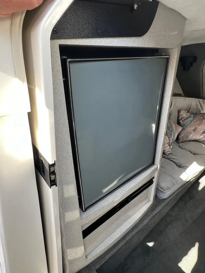 Slide: The Image of Interior of 1994 Checkmate 253 Convincor boat with modern TV installation. - 17