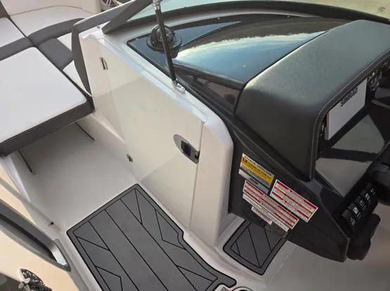 Slide: The Image of 2025 Monterey M4 boat interior with sleek dashboard and seating. - 12