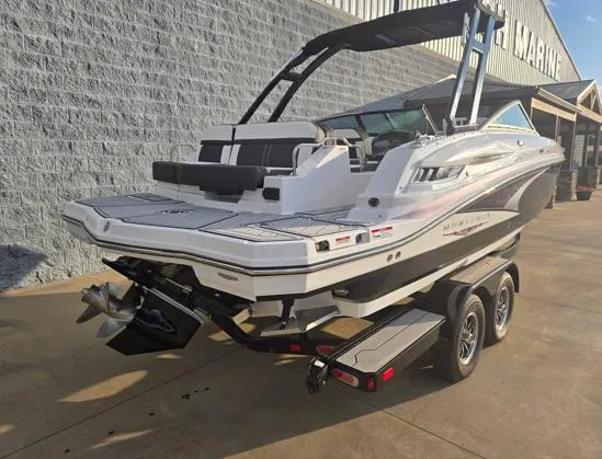 Slide: The Image of 2025 Monterey M4 boat on trailer, parked outside a marine store. - 13
