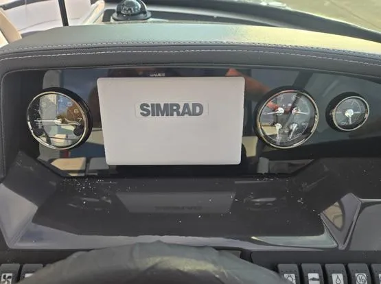 Slide: The Image of 2025 Monterey M4 dashboard with Simrad display and gauges. - 2