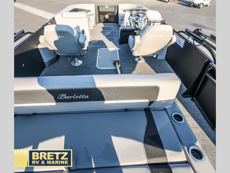 Slide: The Image of 2025 Aria Cast-N-Cruise A22CC boat interior with seating and steering wheel, Bretz RV & Marine. - 17
