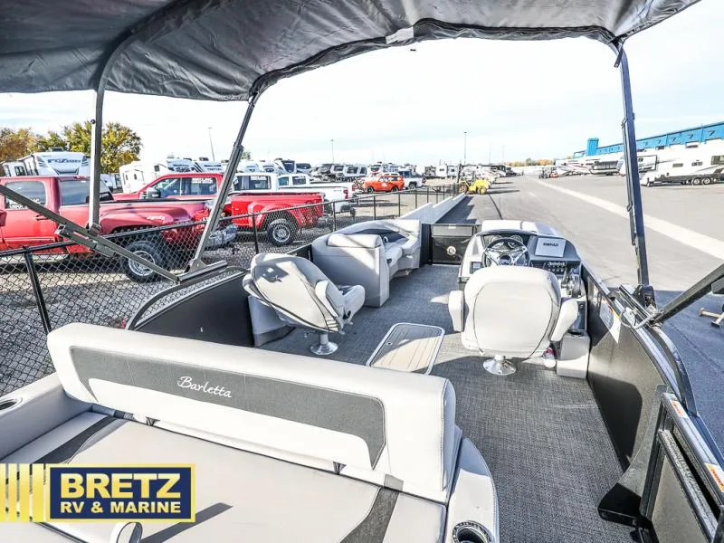 Slide: The Image of 2025 Aria Cast-N-Cruise A22CC boat interior at Bretz RV & Marine dealership. - 18