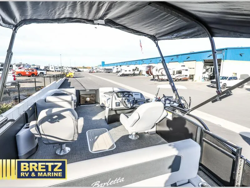 Slide: The Image of 2025 Aria Cast-N-Cruise A22CC boat interior at Bretz RV & Marine dealership. - 19