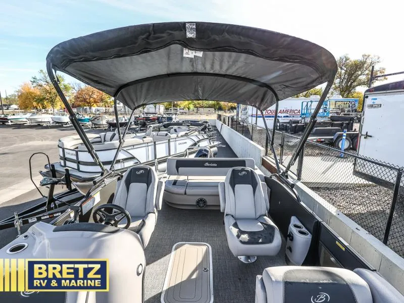 Slide: The Image of 2025 Aria Cast-N-Cruise A22CC boat interior at Bretz RV & Marine dealership. - 23