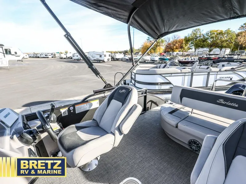 Slide: The Image of 2025 Aria Cast-N-Cruise A22CC boat interior at Bretz RV & Marine dealership. - 27