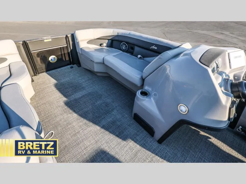 Slide: The Image of 2025 Aria Cast-N-Cruise A22CC boat interior with plush seating and modern dashboard. - 31