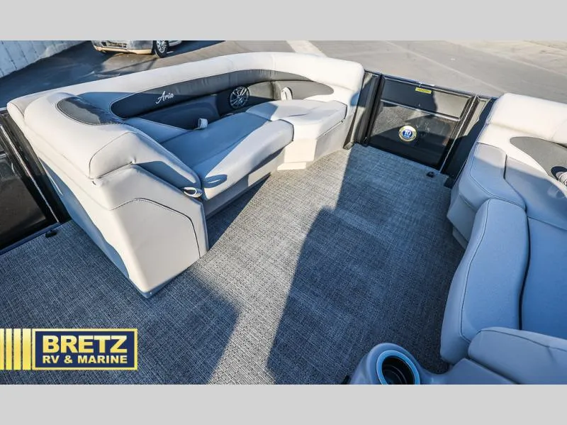 Slide: The Image of 2025 Aria Cast-N-Cruise A22CC boat interior with plush seating, showcased by Bretz RV & Marine. - 32