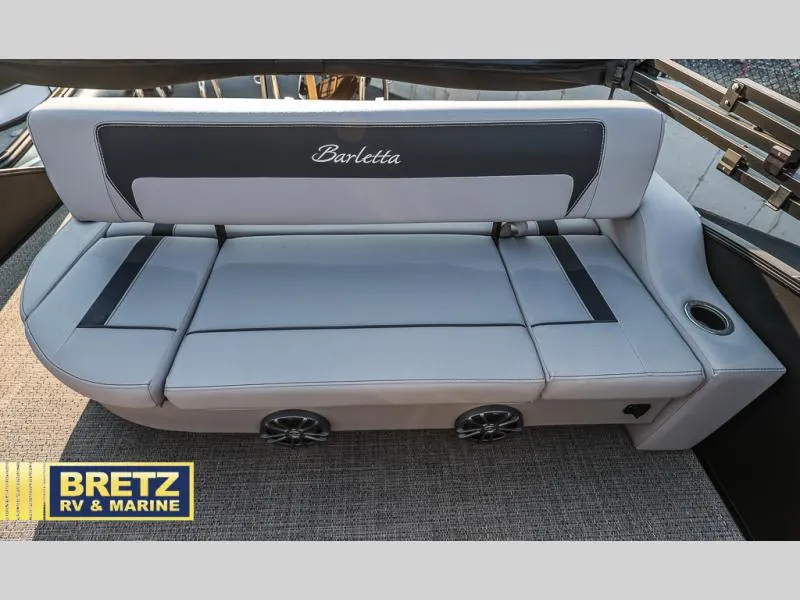 Slide: The Image of Barletta boat seating on 2025 Aria Cast-N-Cruise A22CC, featuring integrated speakers and cup holder. - 35