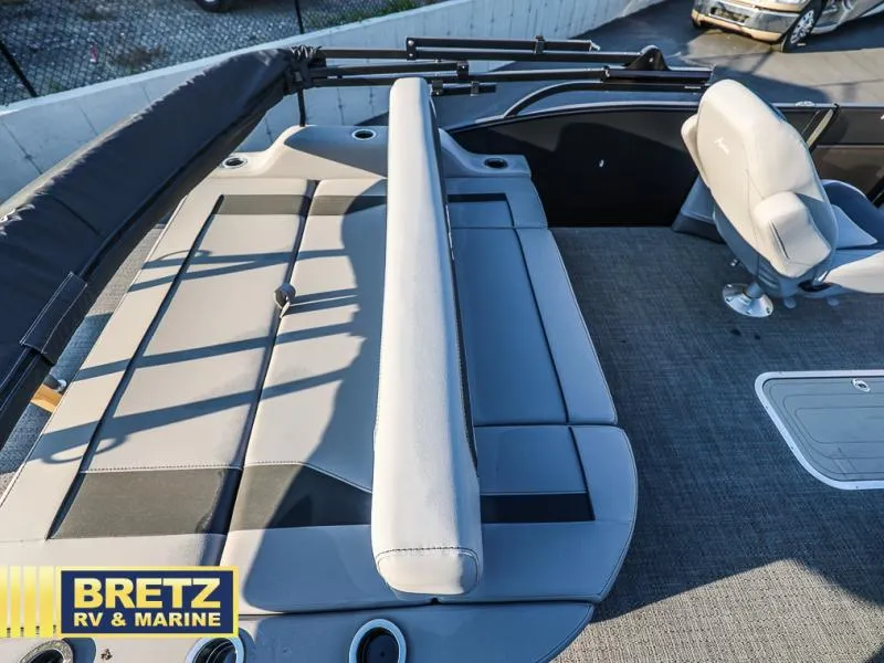 Slide: The Image of 2025 Aria Cast-N-Cruise A22CC boat interior with seating and carpeted flooring. - 36