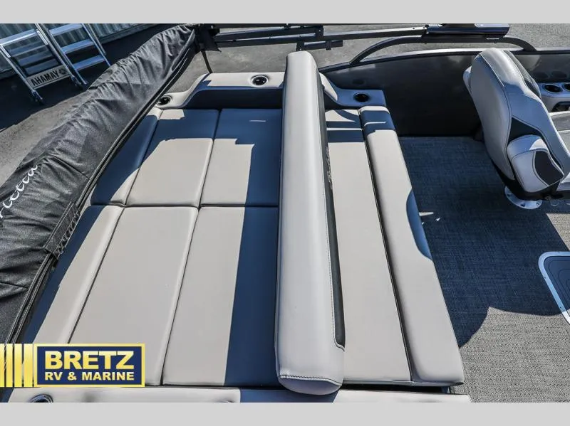 Slide: The Image of 2025 Cabrio Ultra-Lounge C24UC boat interior with plush seating, showcased by Bretz RV & Marine. - 16