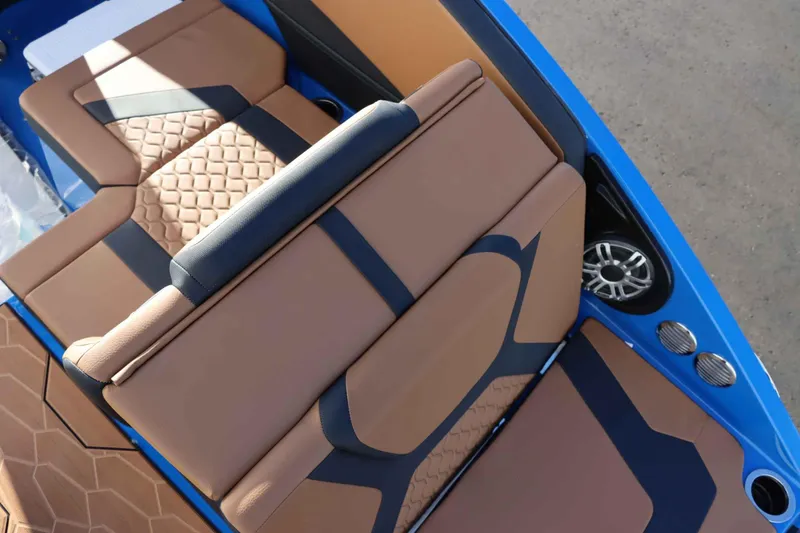 Slide: The Image of 2025 Yamaha Boats 222XD interior with brown and black seating, stylish design. - 11