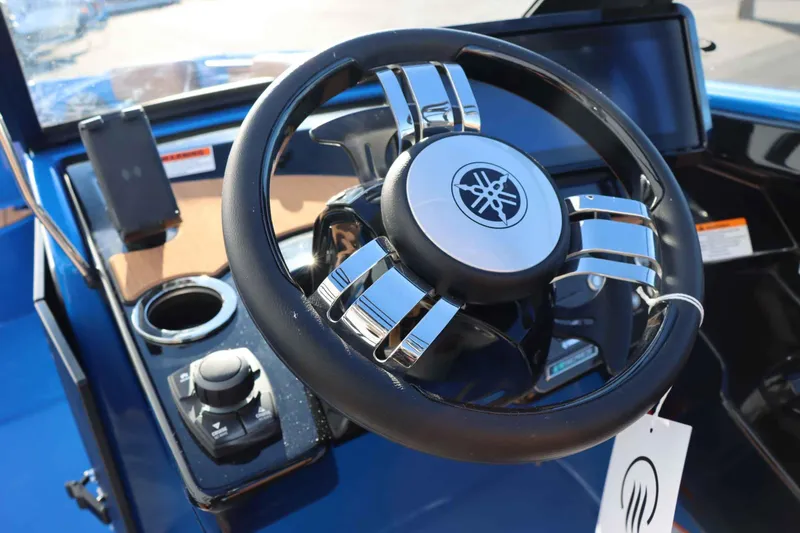 Slide: The Image of 2025 Yamaha Boats 222XD steering wheel and dashboard close-up. - 13
