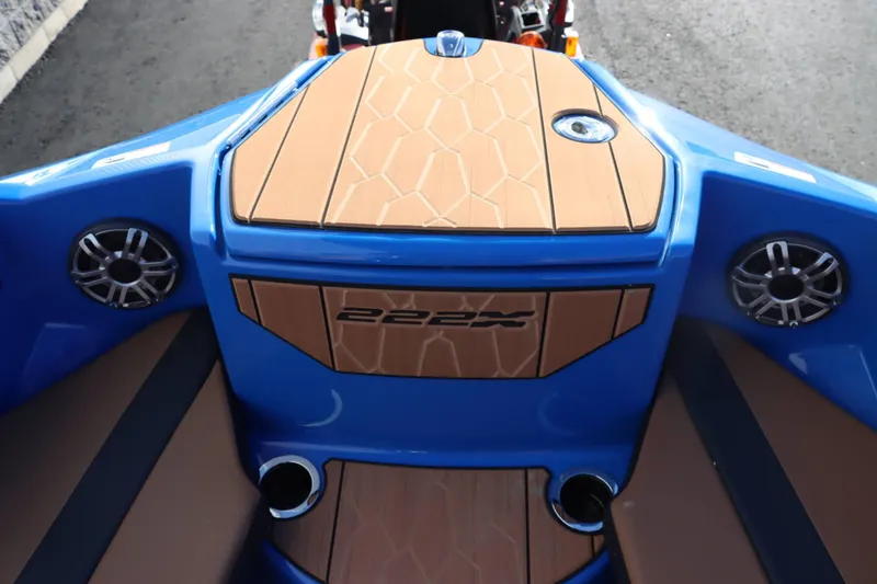Slide: The Image of 2025 Yamaha Boats 222XD interior with speakers and stylish deck design. - 21