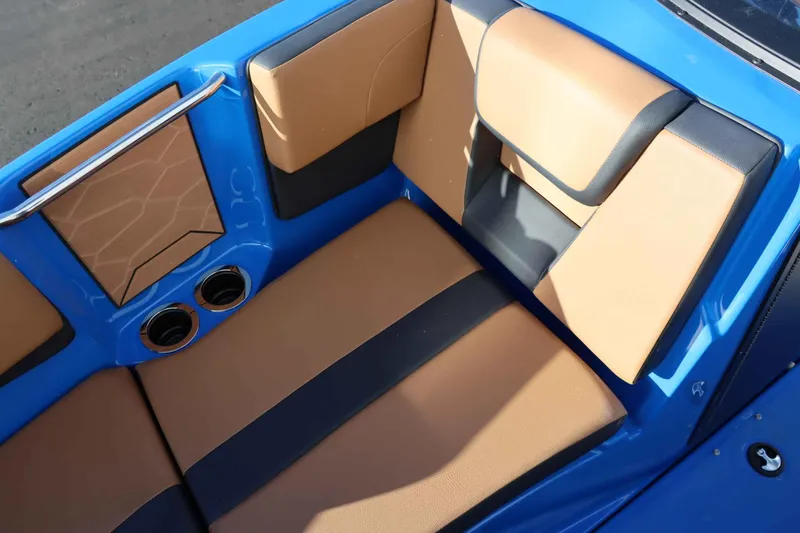 Slide: The Image of 2025 Yamaha Boats 222XD interior seating with tan and black upholstery. - 24