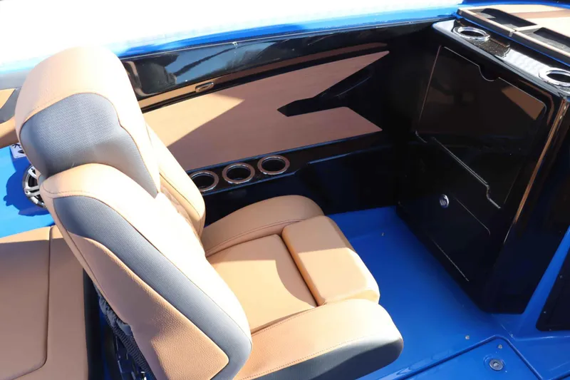 Slide: The Image of 2025 Yamaha Boats 222XD interior with tan and gray seating, sleek design. - 27