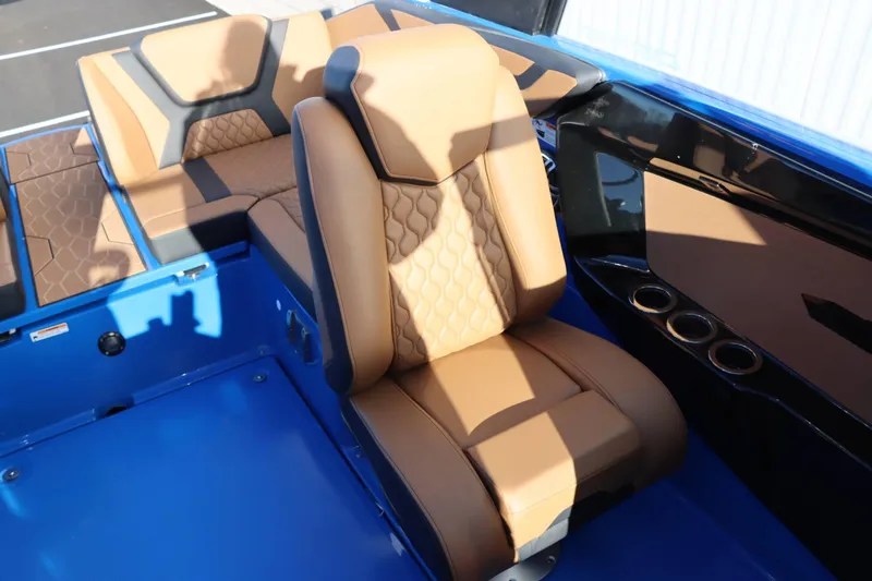 Slide: The Image of Luxurious interior of 2025 Yamaha Boats 222XD with tan leather seating. - 29