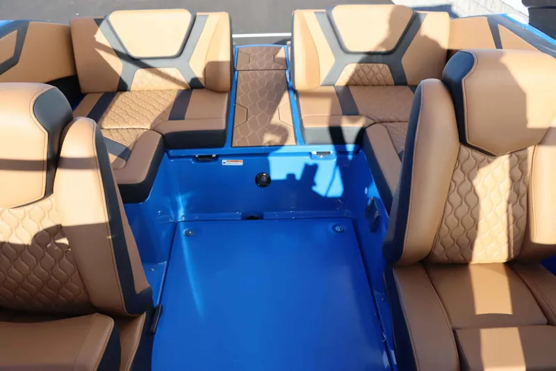 Slide: The Image of Luxurious interior of 2025 Yamaha Boats 222XD with tan and black seating. - 30