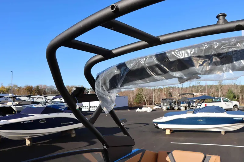 Slide: The Image of 2025 Yamaha Boats 222XD in a boatyard, showcasing sleek design and modern features. - 31