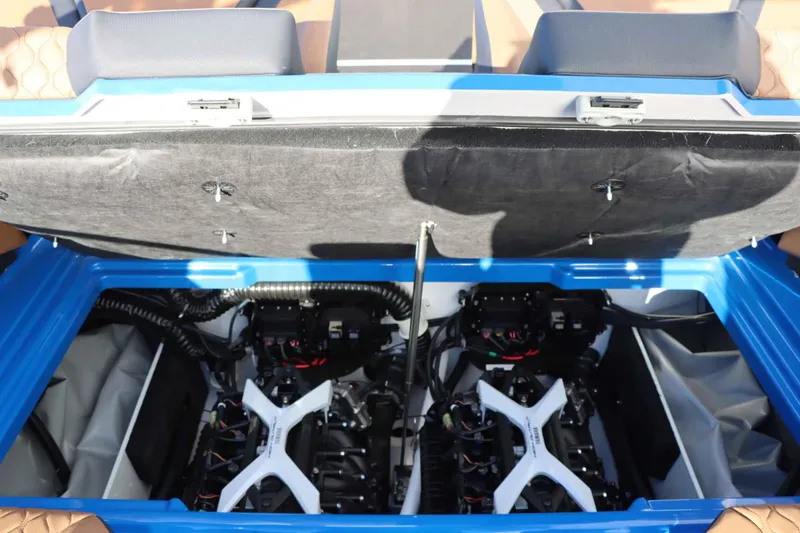 Slide: The Image of 2025 Yamaha Boats 222XD engine compartment with dual engines and blue interior. - 32