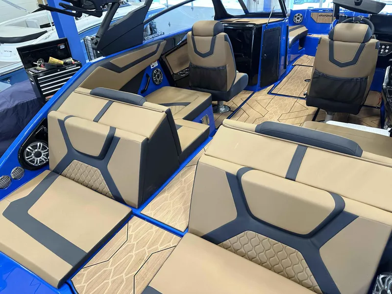 Slide: The Image of Interior of 2025 Yamaha Boats 222XE, featuring modern seating and stylish design. - 10