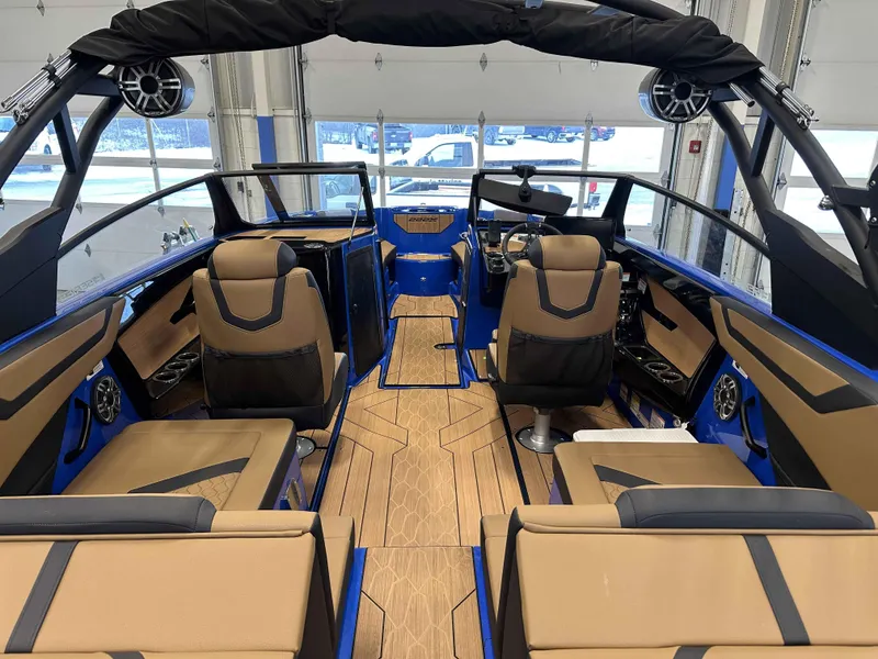 Slide: The Image of Interior of 2025 Yamaha Boats 222XE, featuring sleek seating and modern design elements. - 9