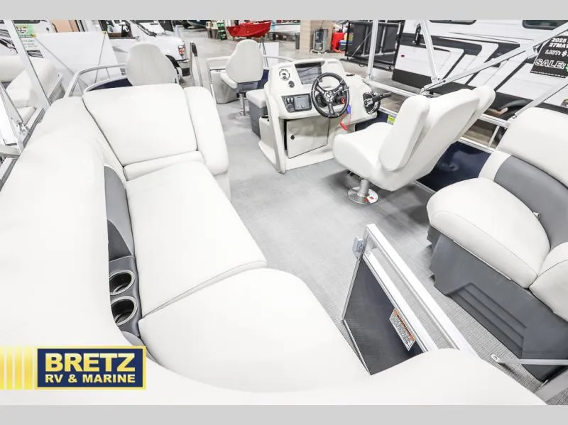 Slide: The Image of 2025 Vista Fish 18 boat interior with plush seating and modern dashboard at Bretz RV & Marine. - 15