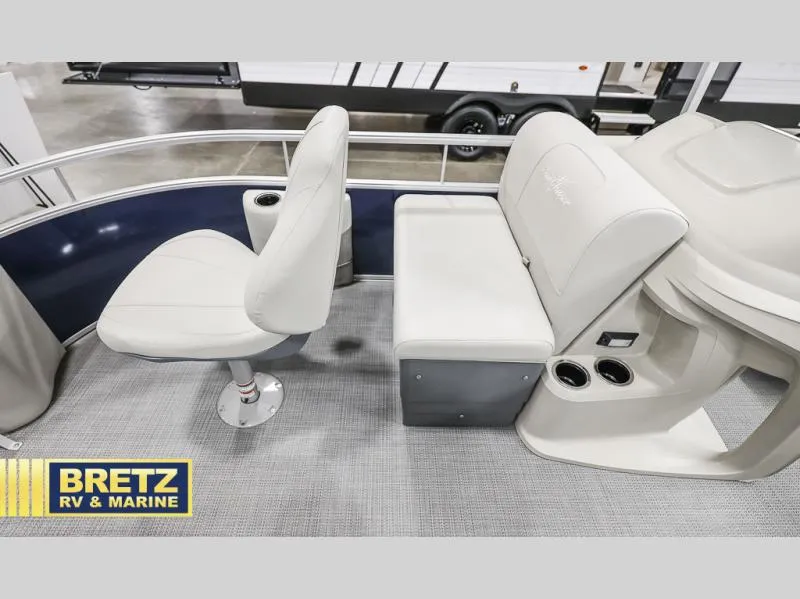 Slide: The Image of 2025 Vista Fish 18 boat interior with white seating and cup holders. - 17