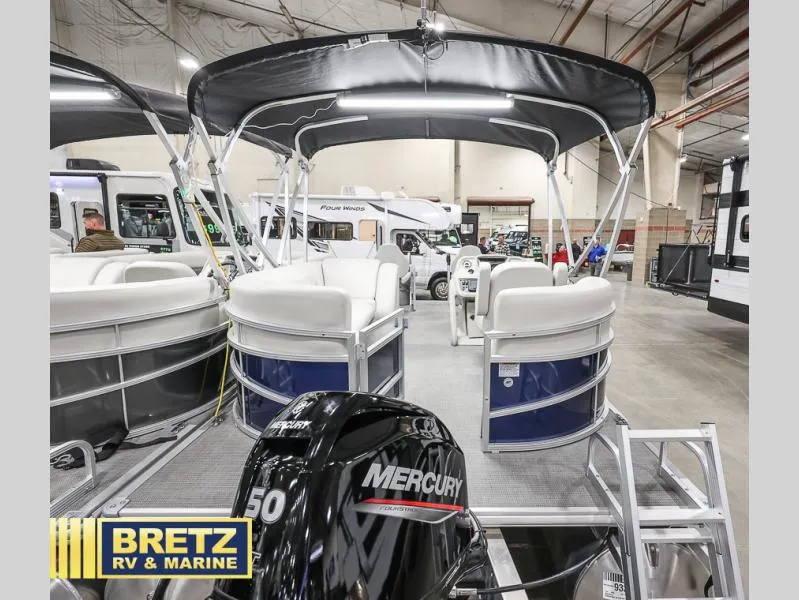 Slide: The Image of Vista Fish 18 boat, 2025 model, with Mercury engine displayed at Bretz RV & Marine showroom. - 6