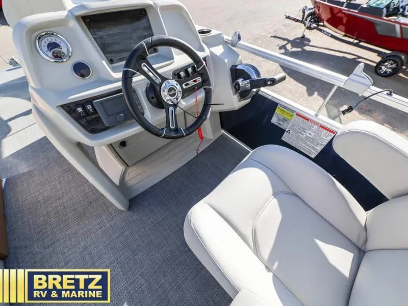 Slide: The Image of Vista Fish 18 boat interior, 2025 model, featuring steering wheel and control panel. - 10