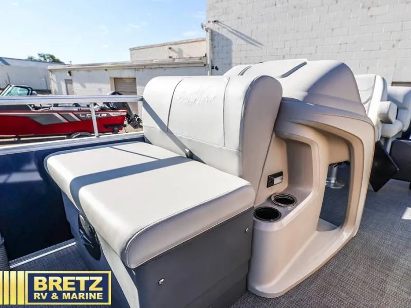 Slide: The Image of 2025 Vista Fish 18 boat interior with beige seating and cup holders at Bretz RV & Marine. - 15