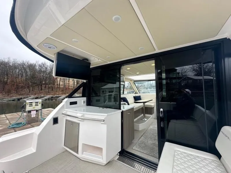Slide: The Image of 2020 Regal 38 Grande Coupe yacht interior with modern seating and sleek design. - 3