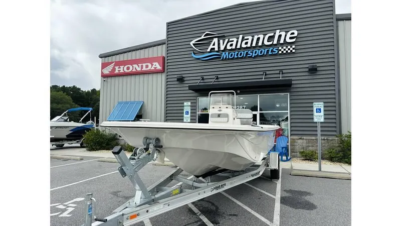 The Image of 2025 Carolina Skiff 21 LS boat on trailer at Avalanche Motorsports dealership. - 1